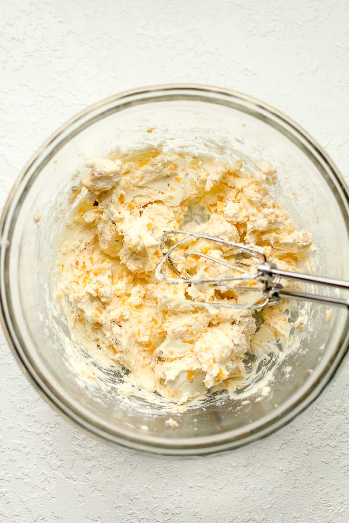 A bowl of the cream cheese filling for the poppers.