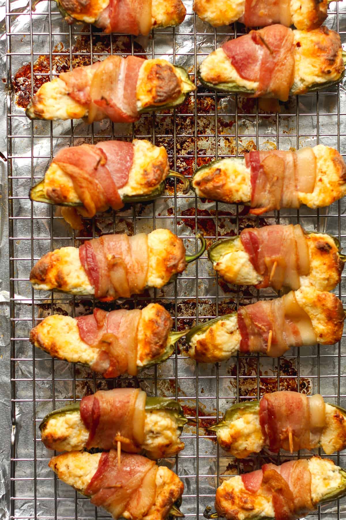 A wire rack of jalapeno poppers.