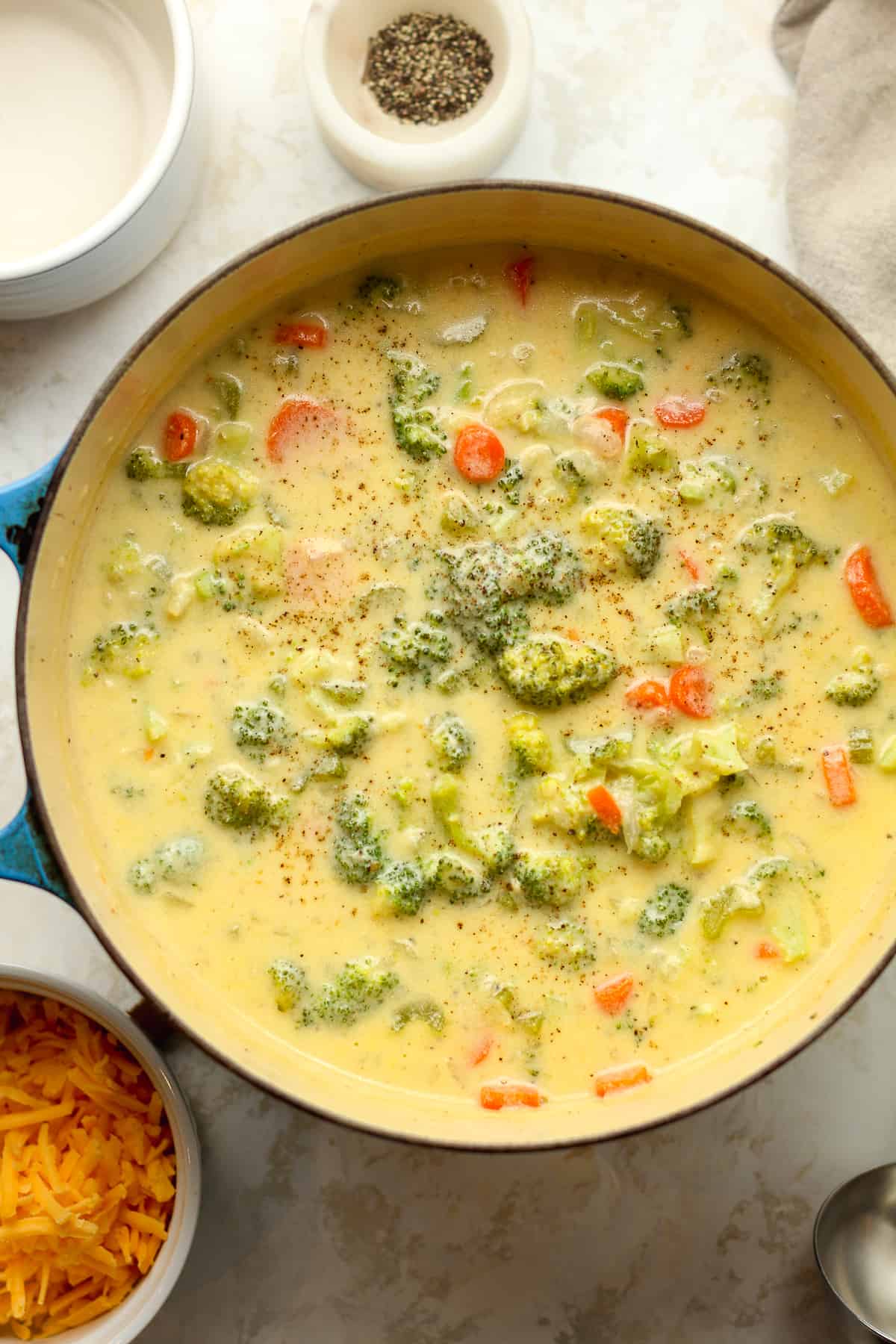 A pot of creamy cheddar broccoli soup.