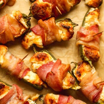 Closeup on some bacon wrapped jalapeño poppers.