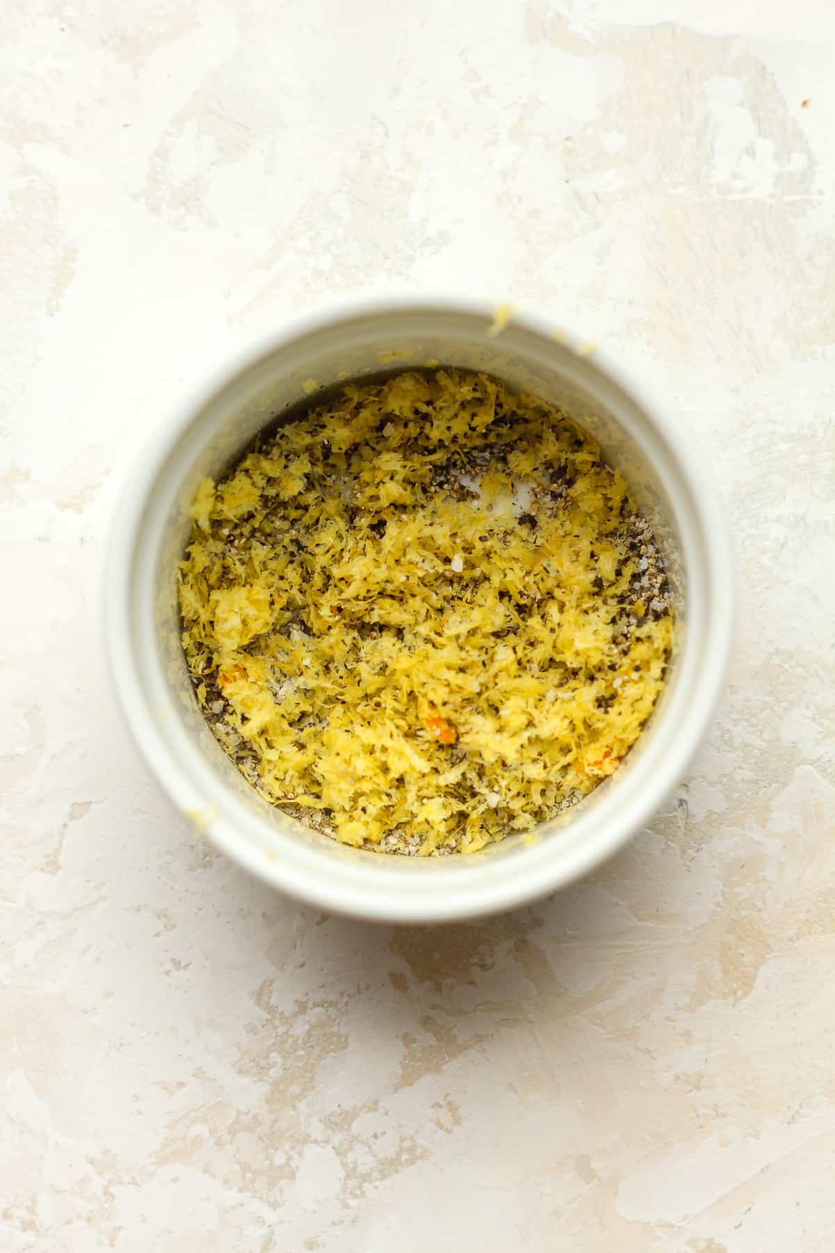 The lemon and seasonings in a small bowl.