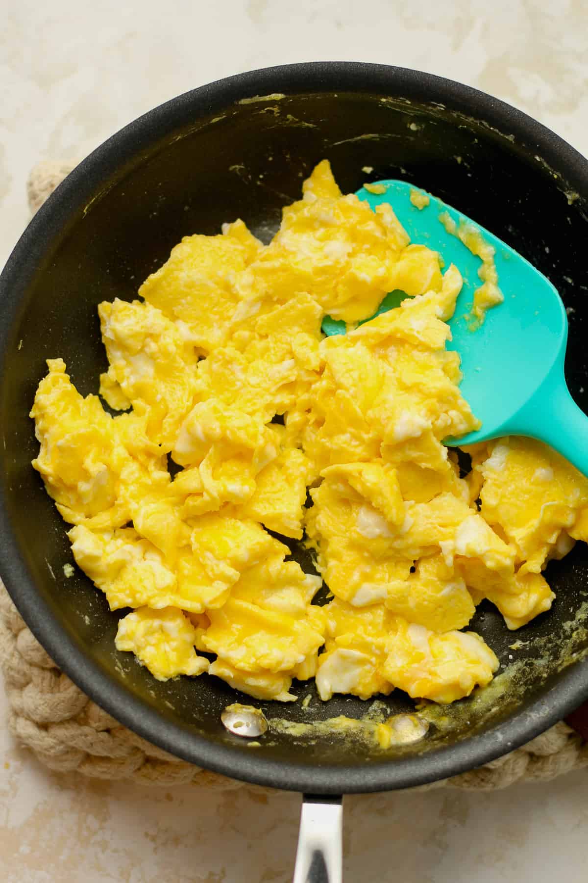 A pan of soft scrambled eggs.