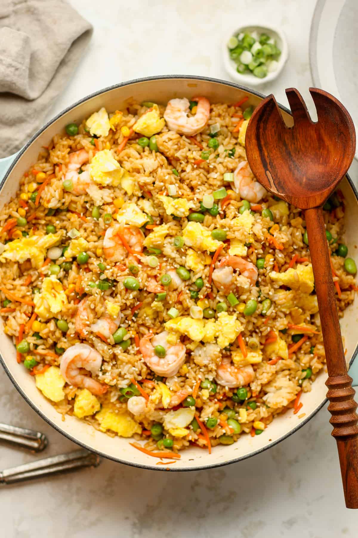 A large pot of shrimp fried rice with soft scrambled eggs.