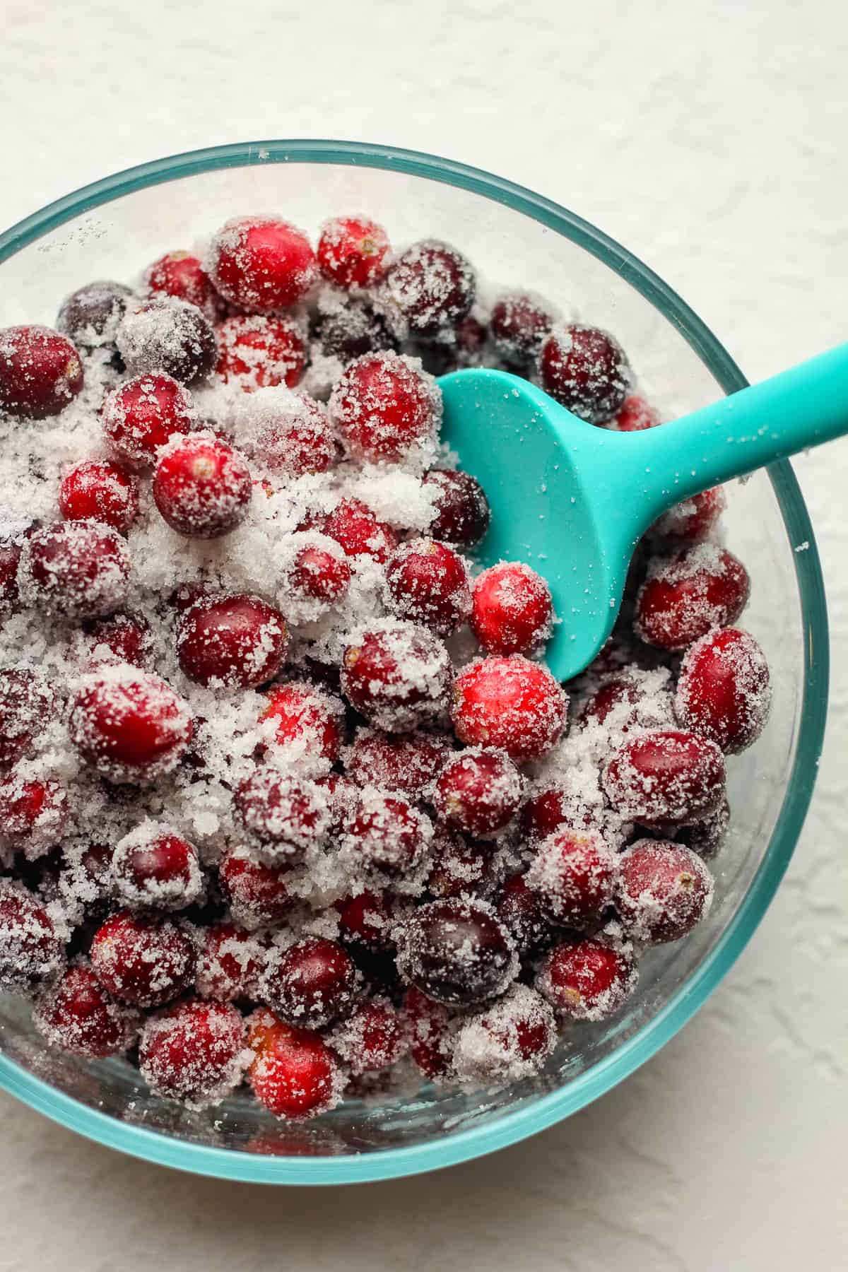 Closeup on a bowl of sugared cranberries.