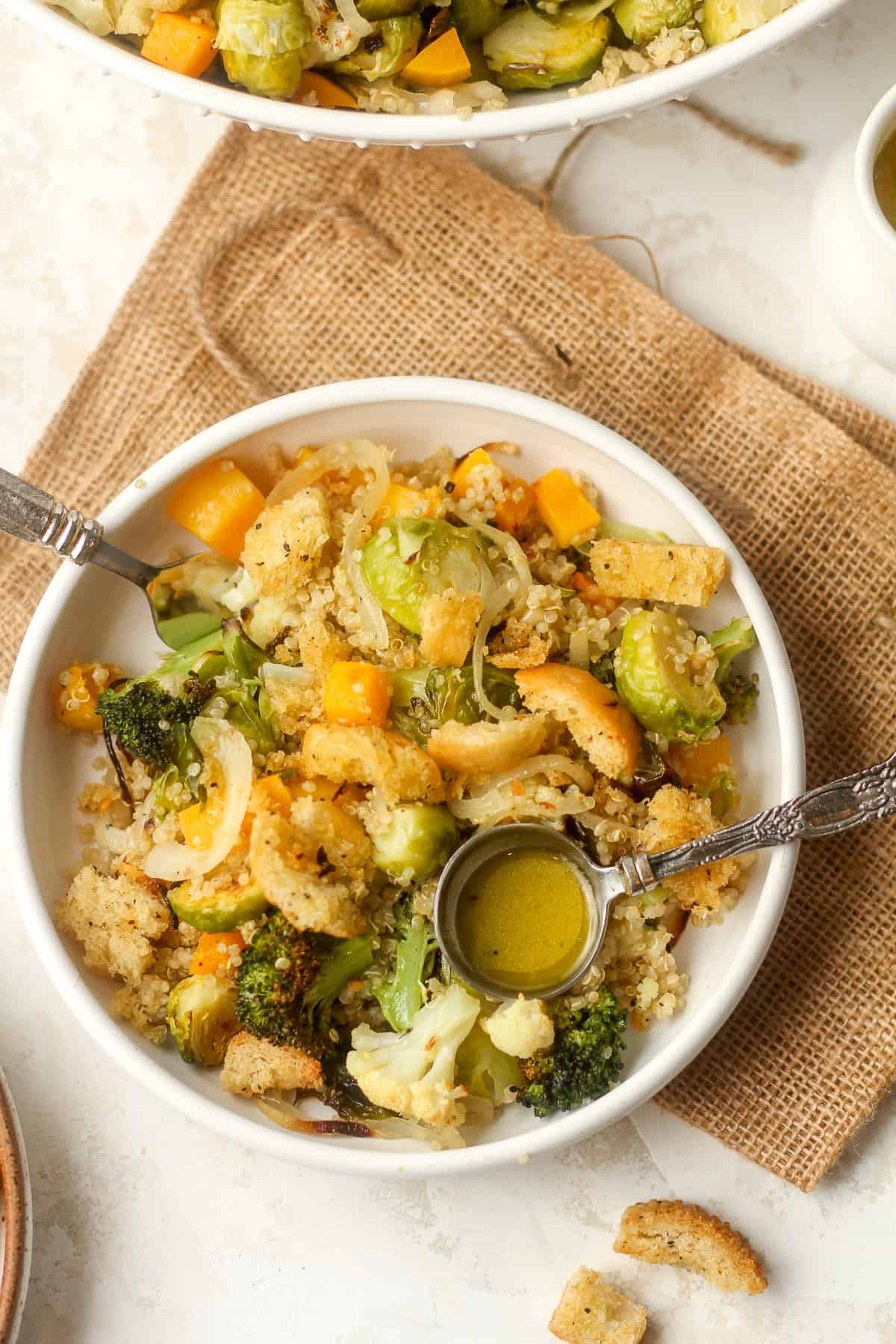 A serving of the roasted veg quinoa salad with a tablespoon of lemon dressing and homemade croutons.
