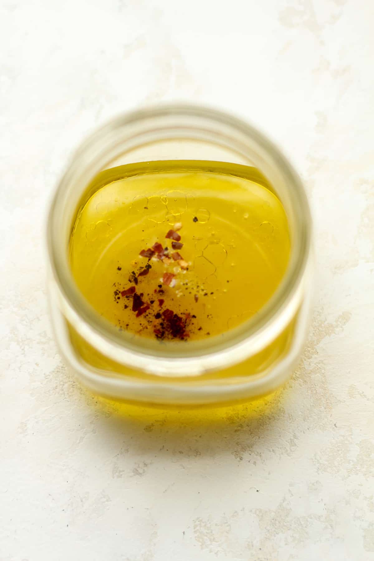 A jar of the lemon dressing ingredients.