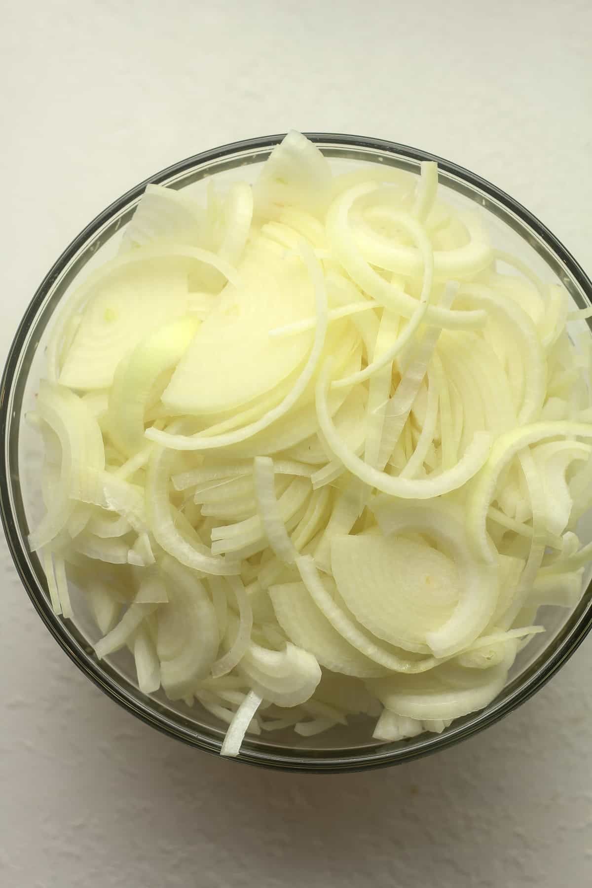 The bowl of sliced onions.