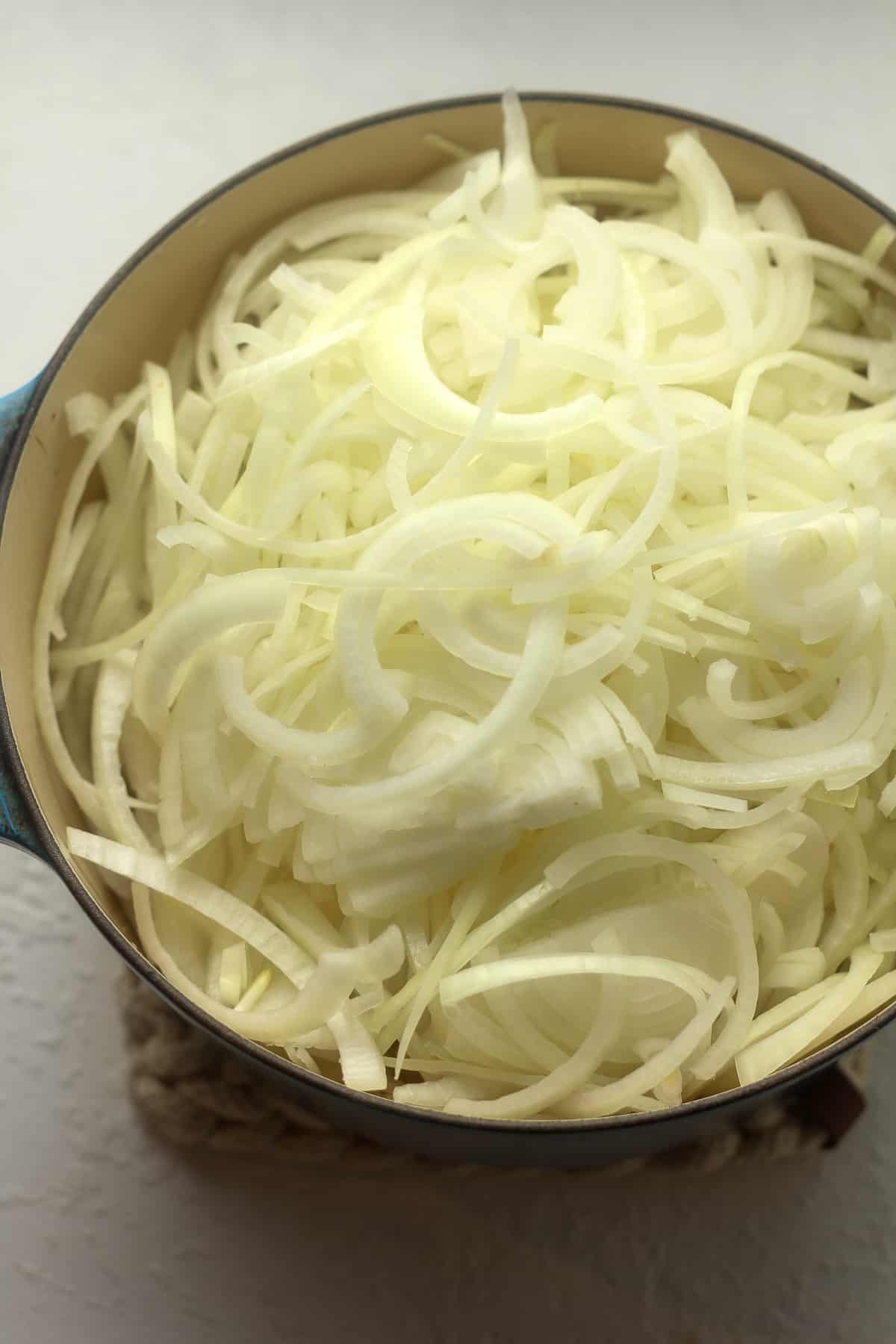 The pot with the sliced onions to the top.
