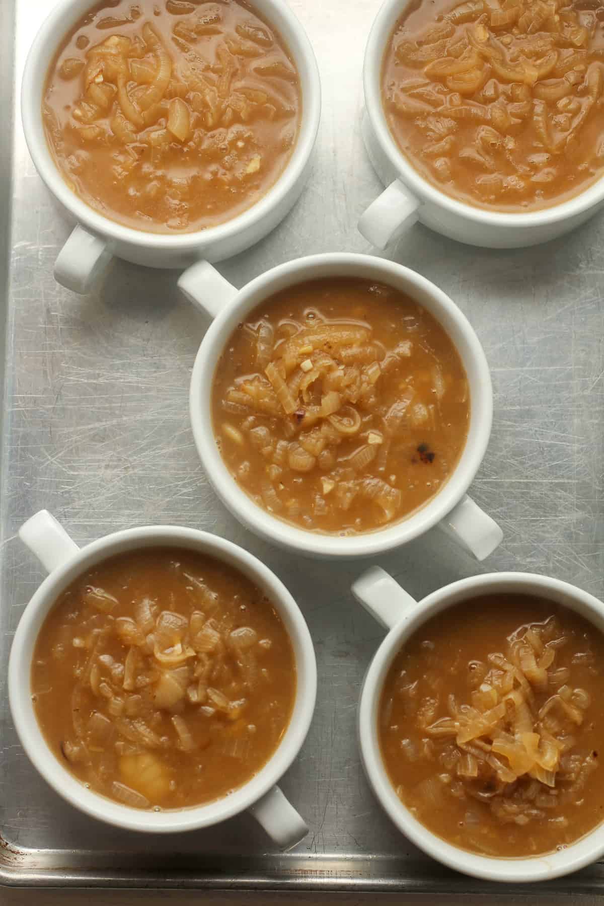 The bowls of onion soup before toppings.