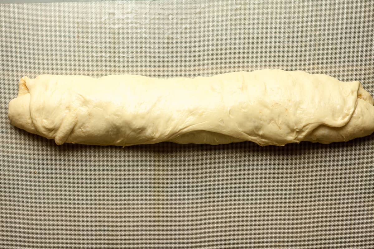 The rolled cinnamon roll dough.
