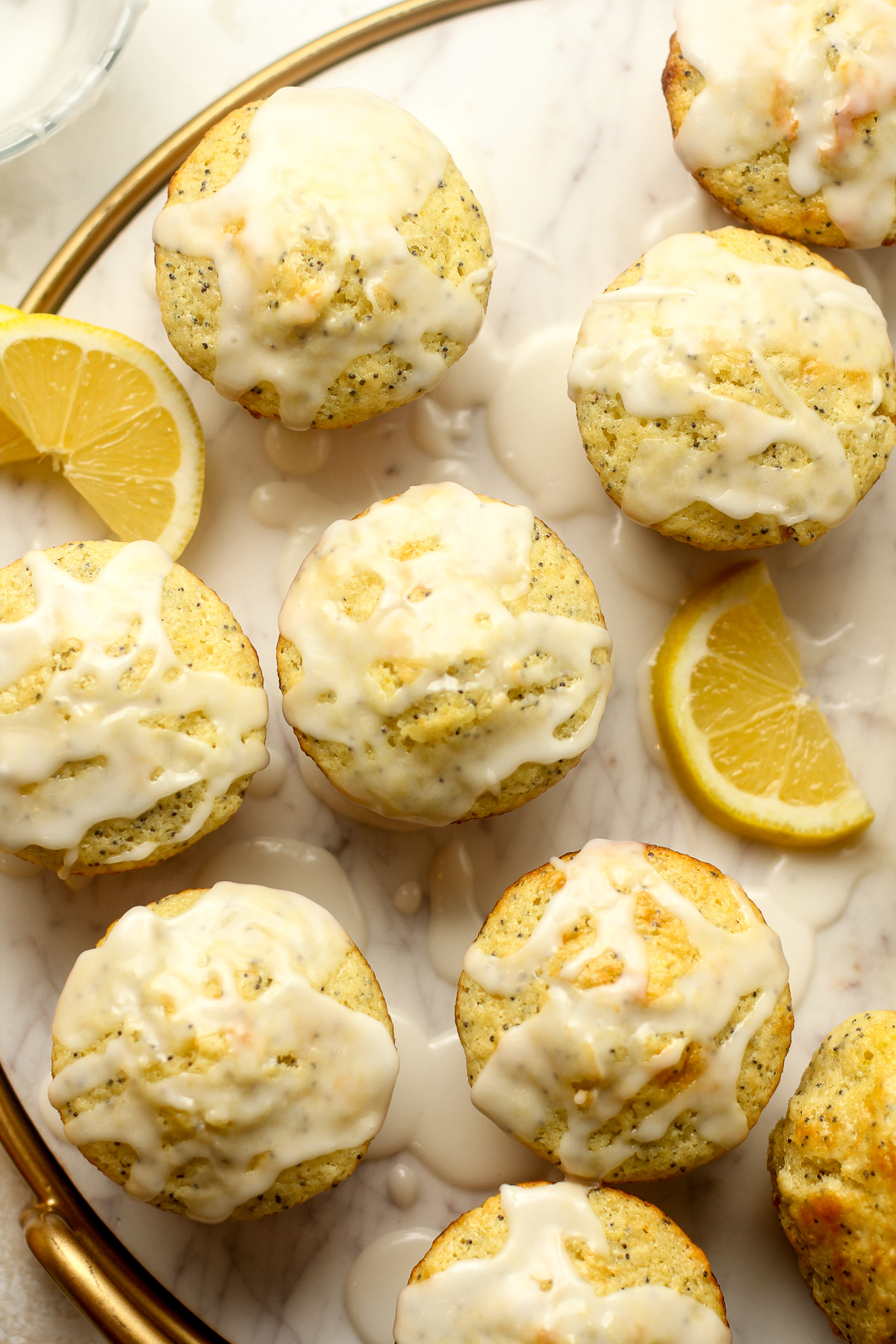 Overhead view of several lemon poppyseed muffins.