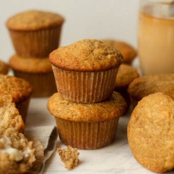 Side view of some stacked banana muffins.