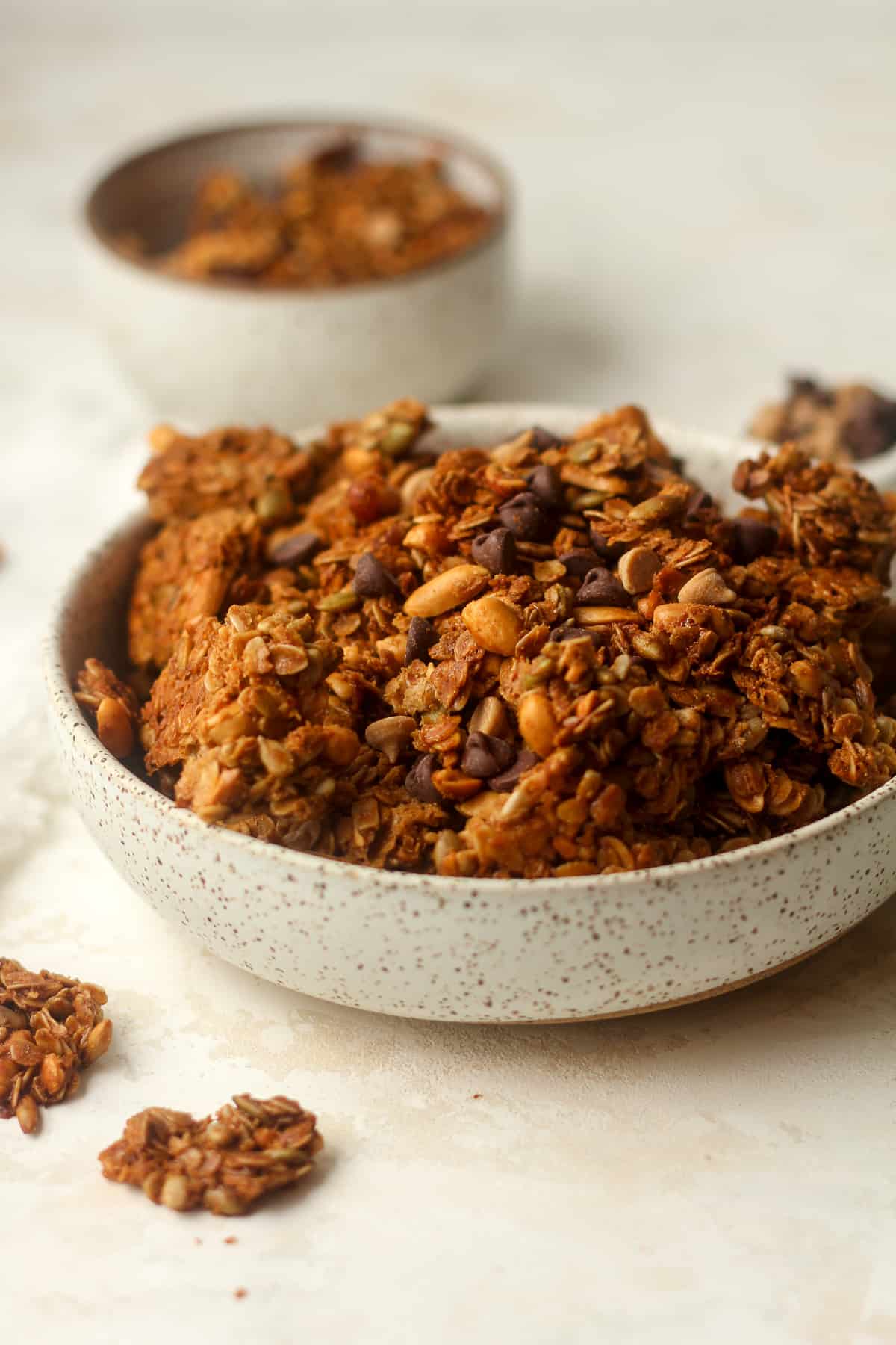Side view of a bowl of peanut butter granola.