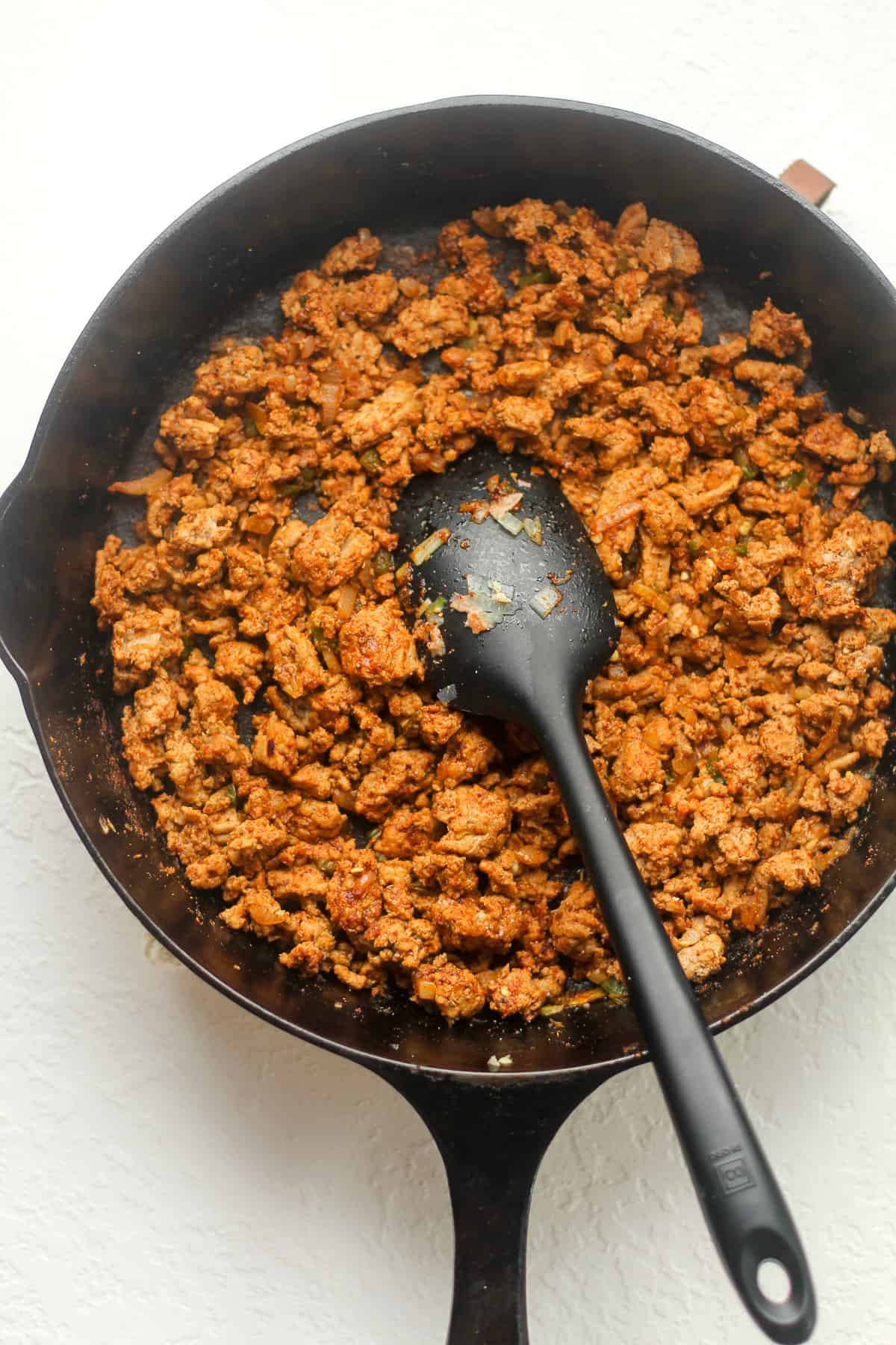 A skillet of the cooked ground turkey with taco seasoning.