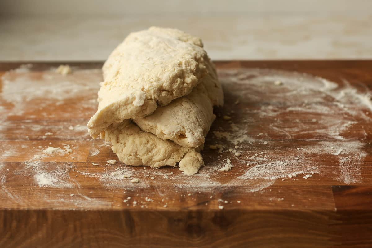 Side view of some biscuit dough folded up in thirds.