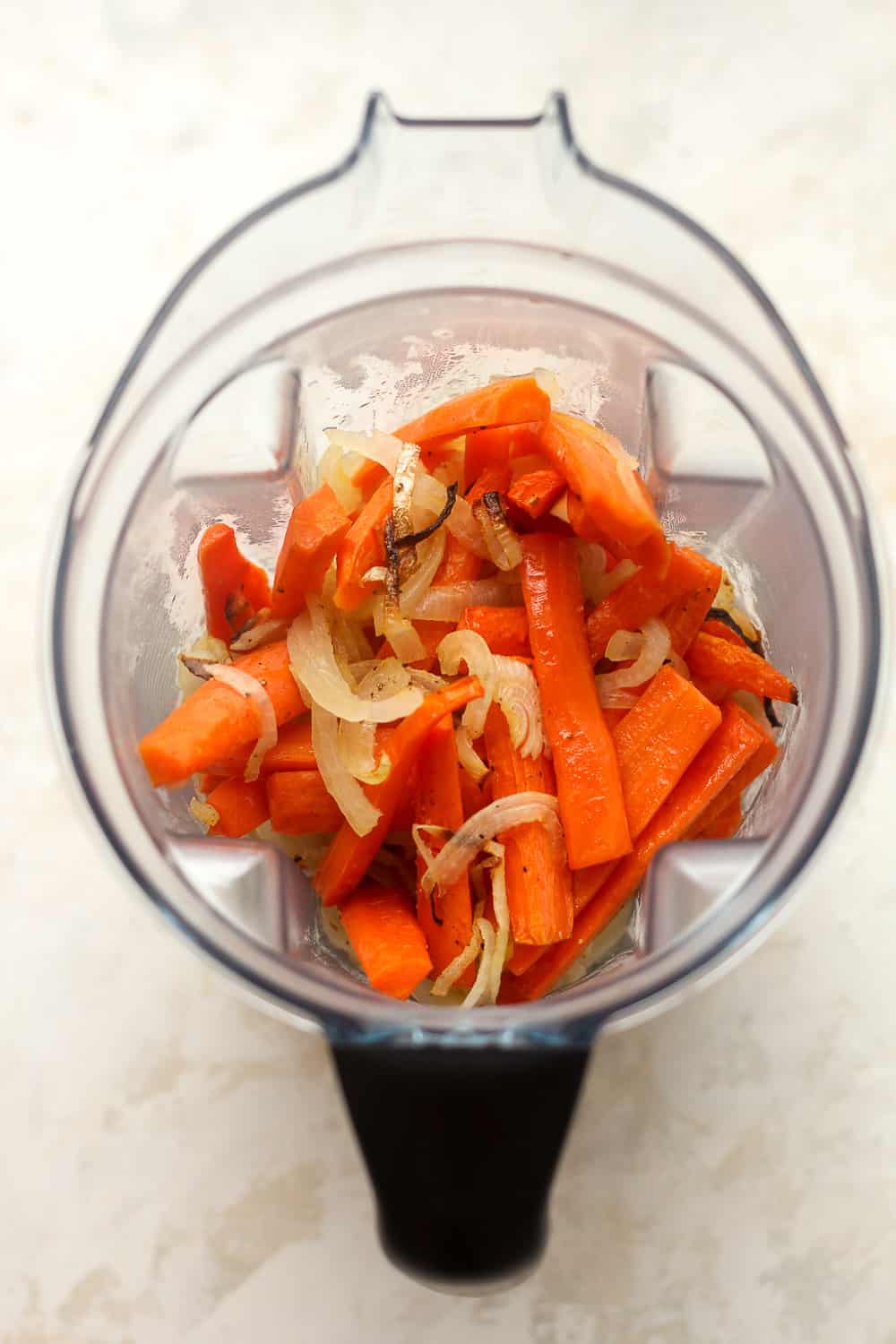 A blender of the roasted carrots and onions.