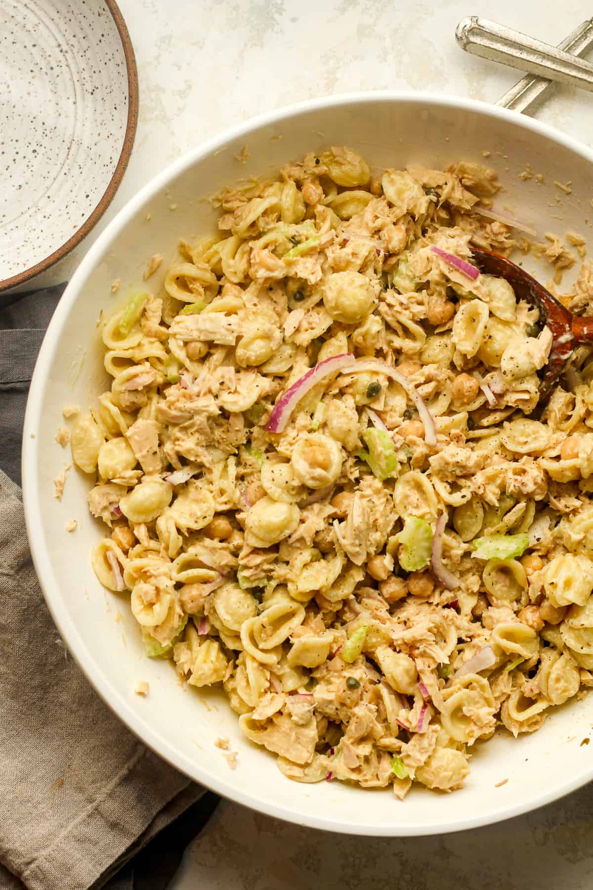 A large bowl of tuna pasta salad with chickpeas.