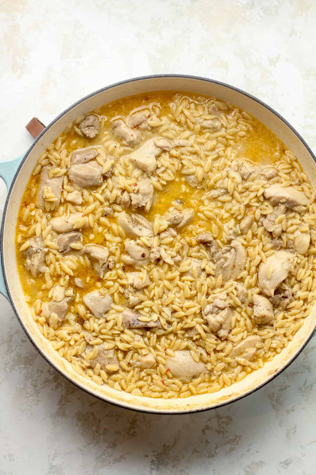 A pot of the cooked chicken orzo.
