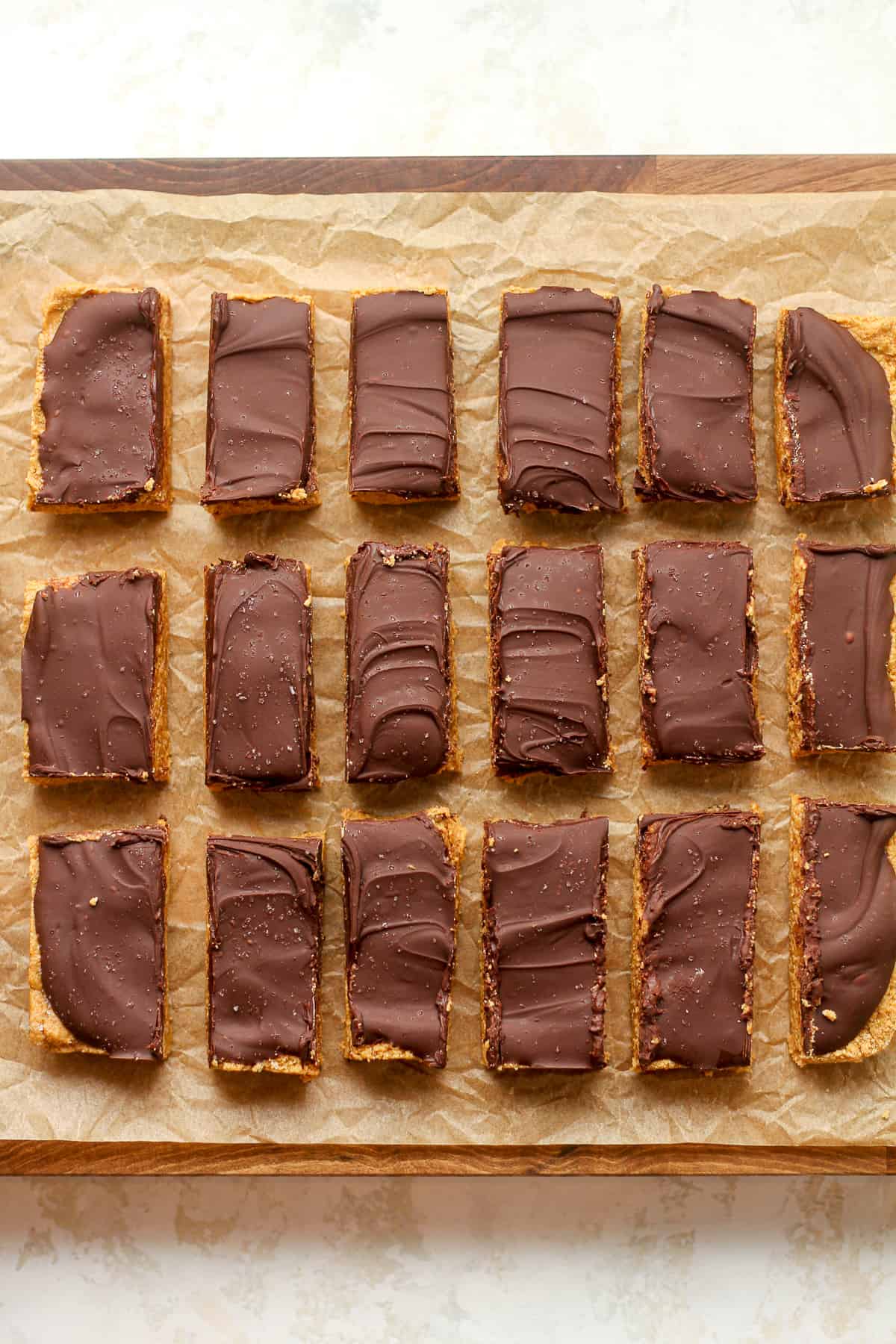 A board with some sliced peanut butter bars.