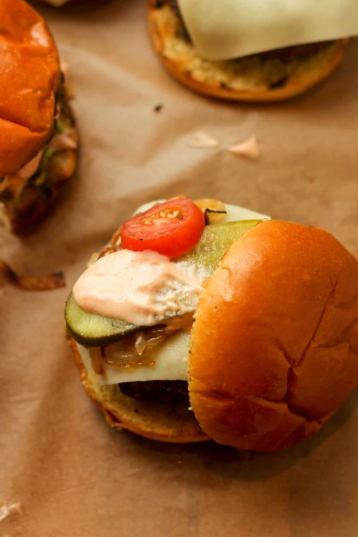 Overhead view of a burger with toppings.