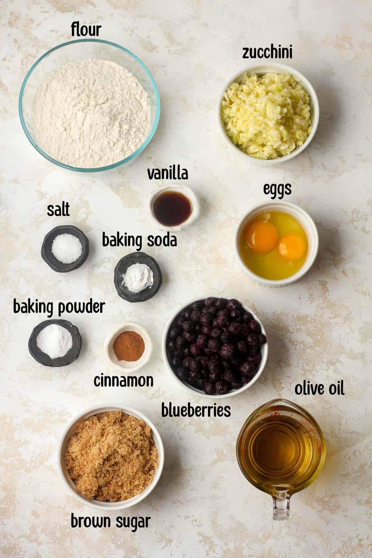 The muffin ingredients in bowls, labeled.