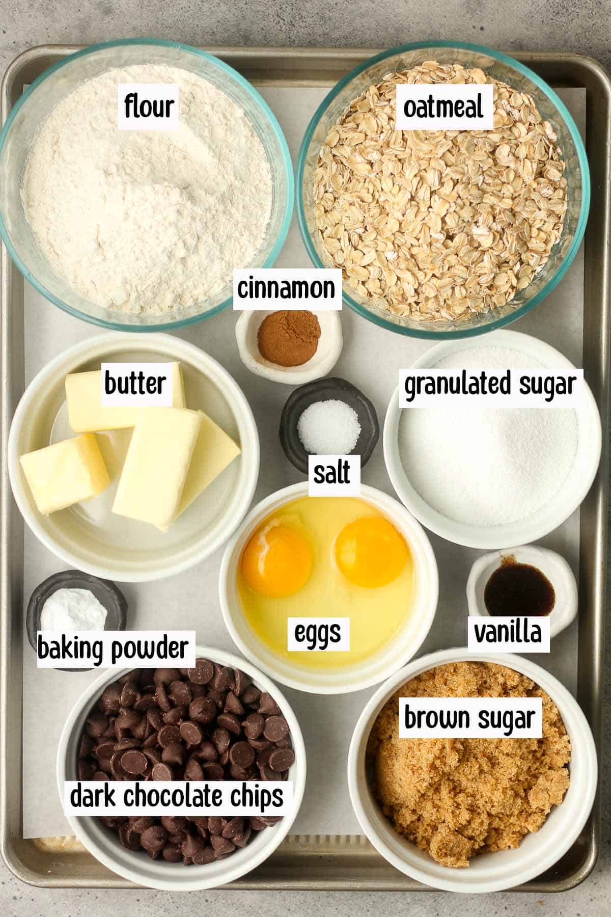 The ingredients for the oatmeal chocolate chip cookies, labeled.