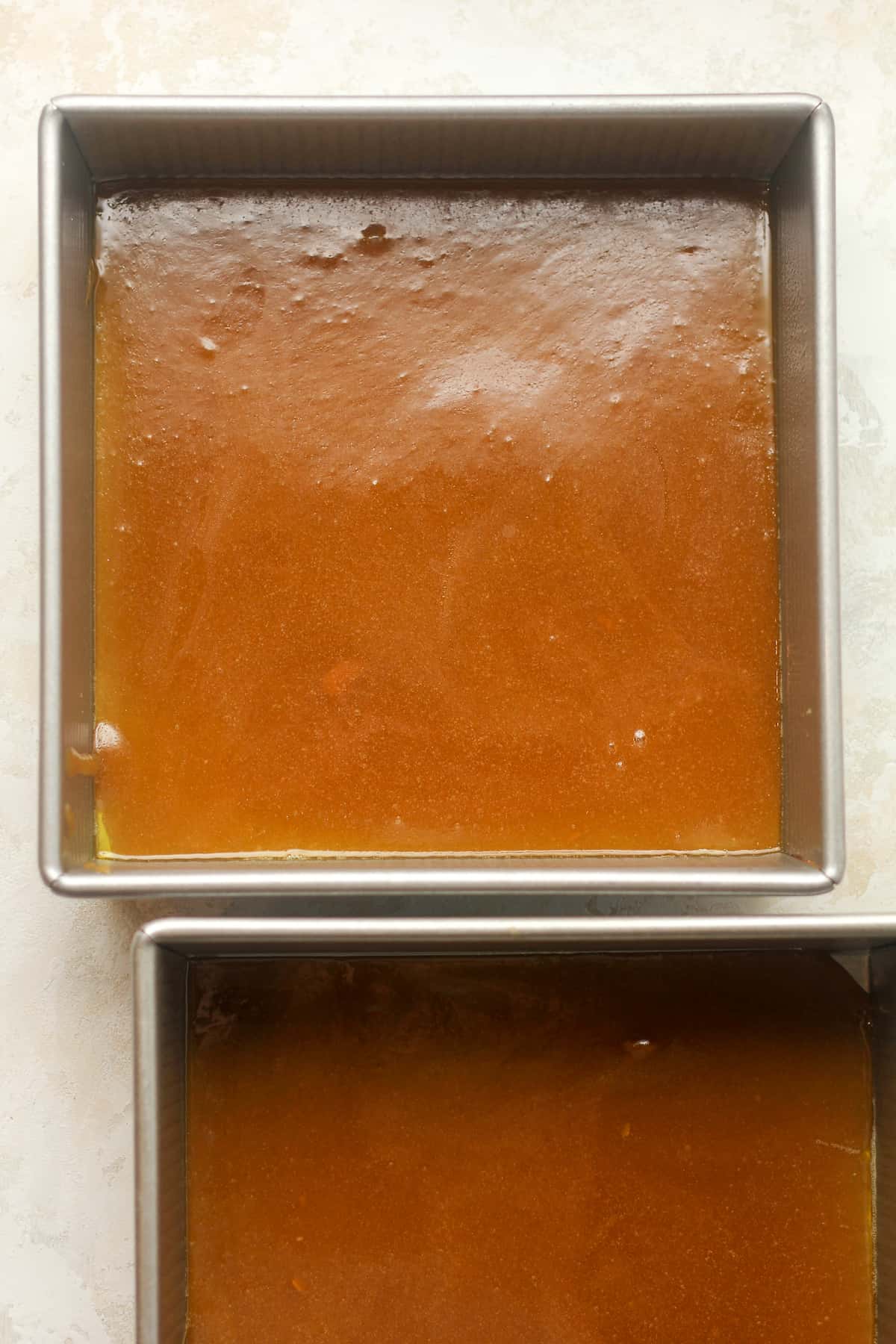 Two square pans of the caramel goo.