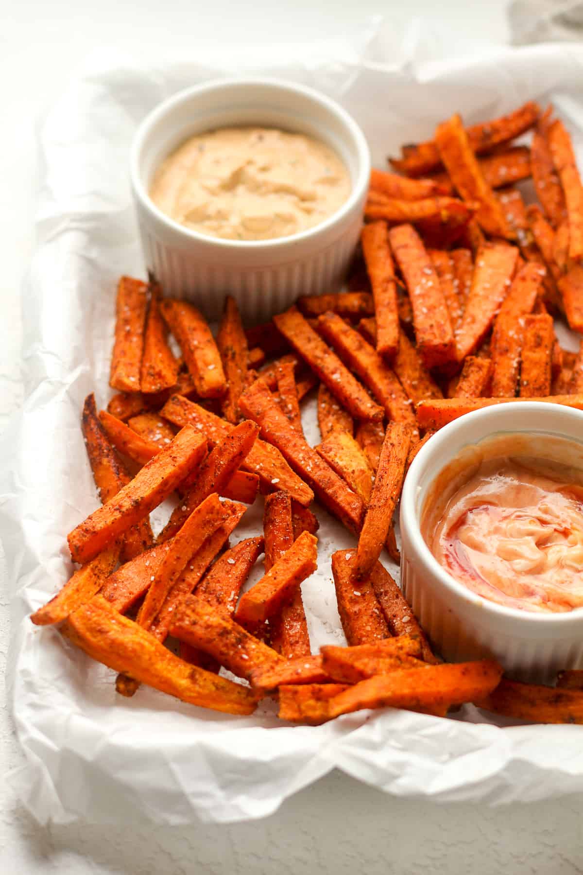 Side view of a tray of sweet potato fries.