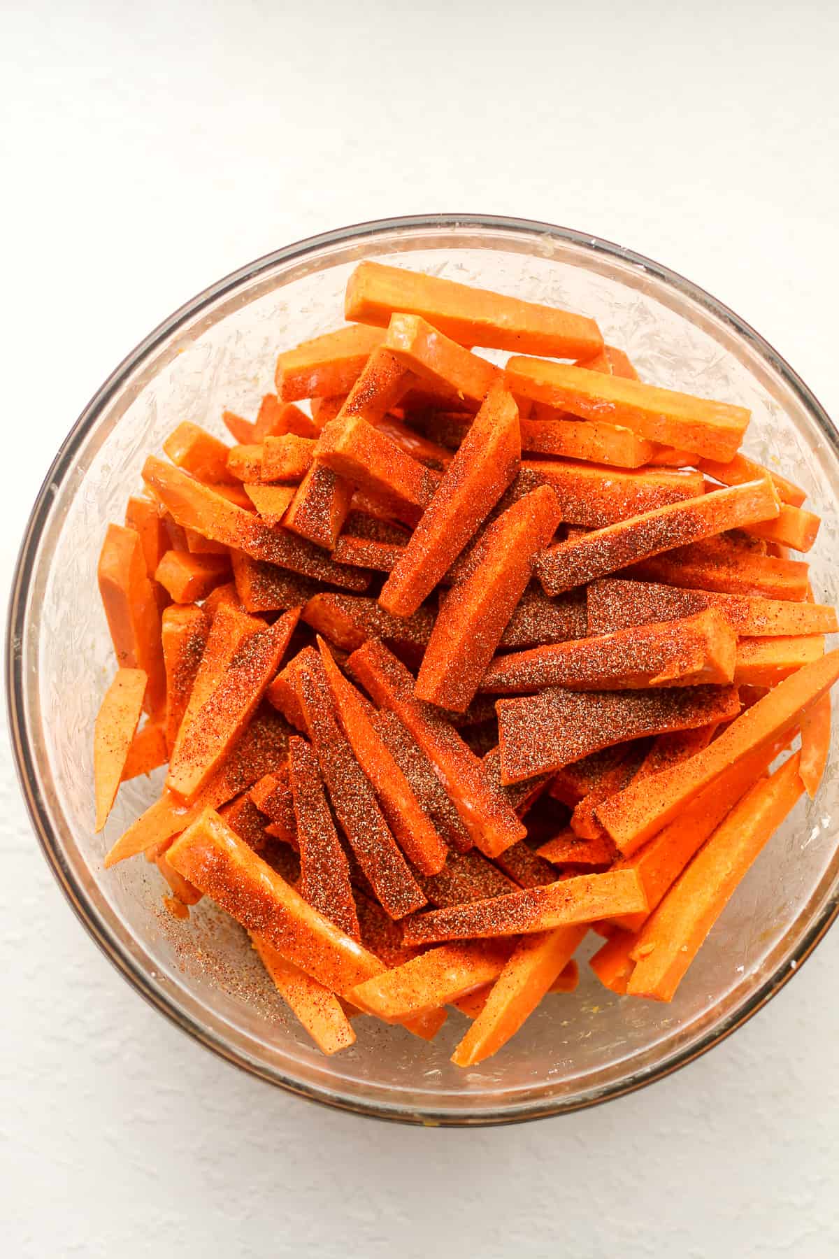 A bowl of sweet potato fries with the spicy seasonings.
