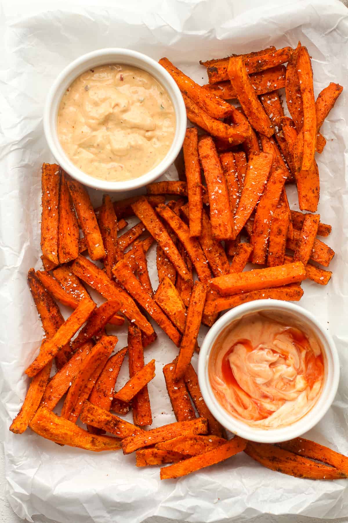 Overhead view of a tray of spicy sweet potato fries.