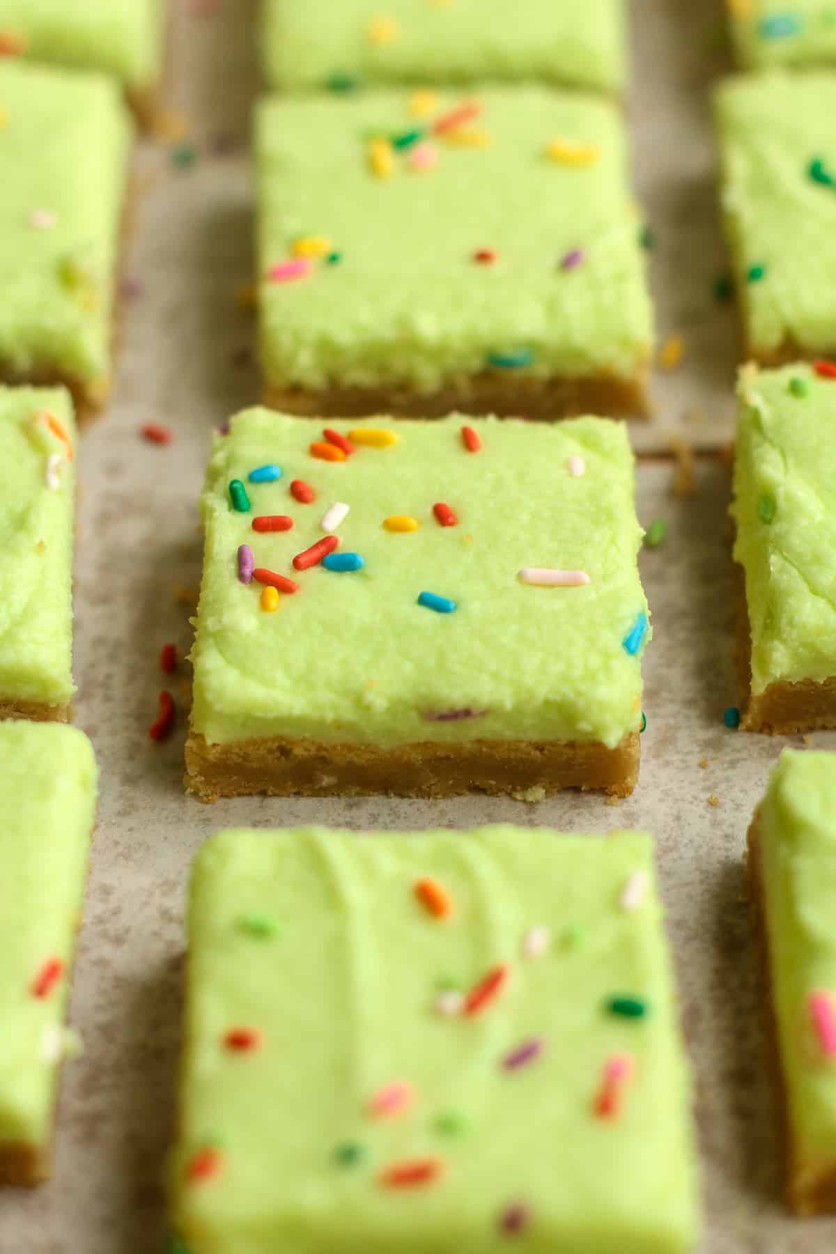 A closeup on a square of blondies with sprinkles.