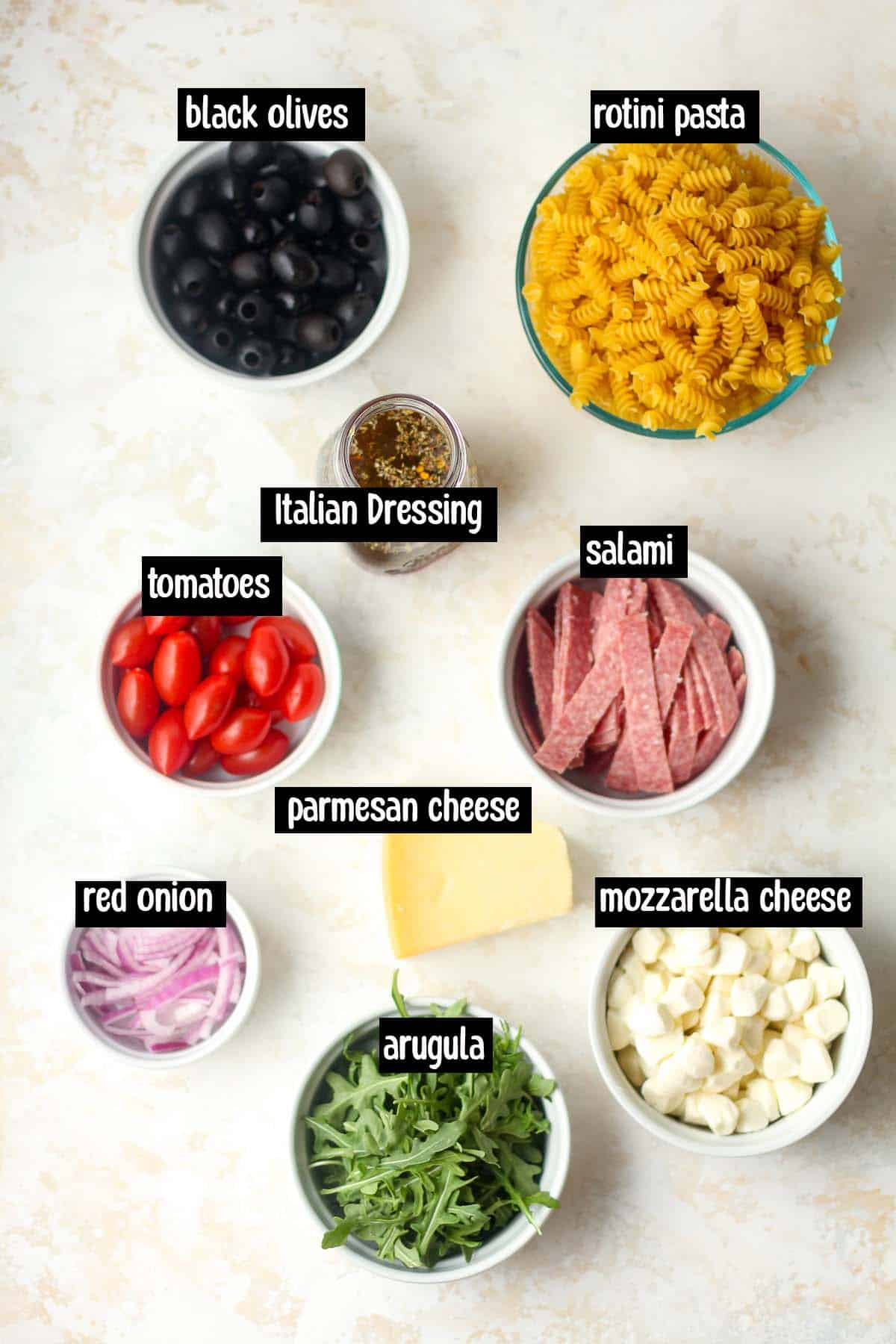 The ingredients (labeled) for the pasta salad.