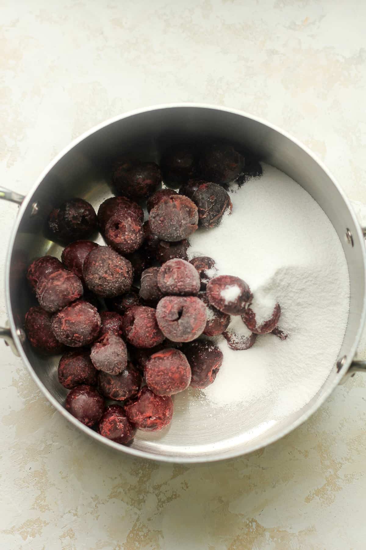 A pan of the frozen cherries plus sugar.