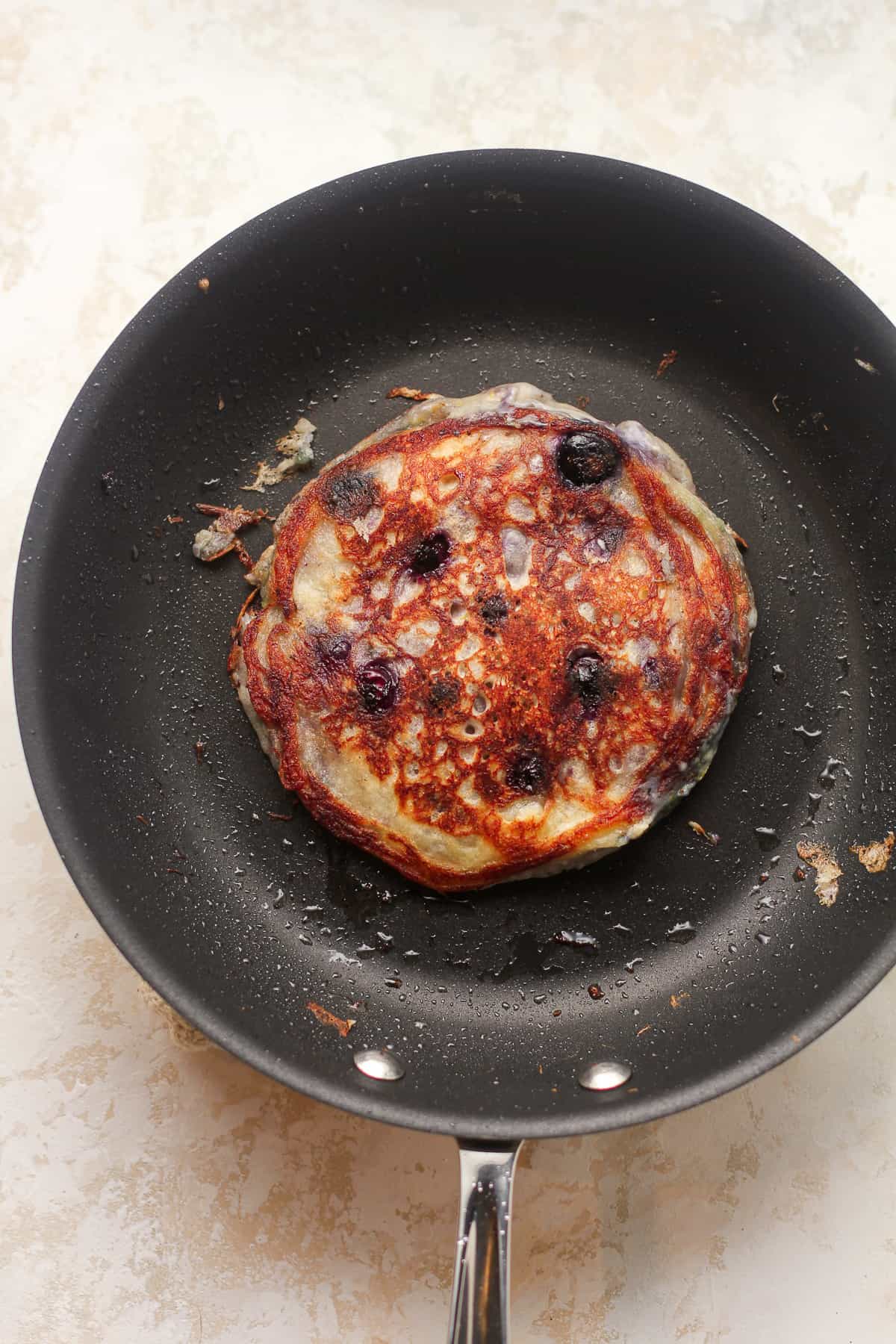A pan of a blueberry pancake.