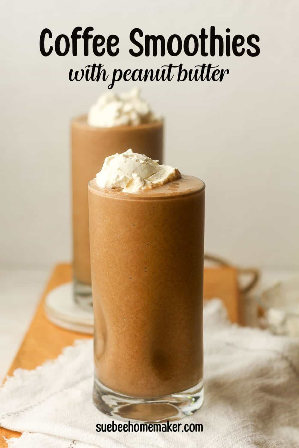 Side view of two glasses of coffee smoothies with peanut butter.