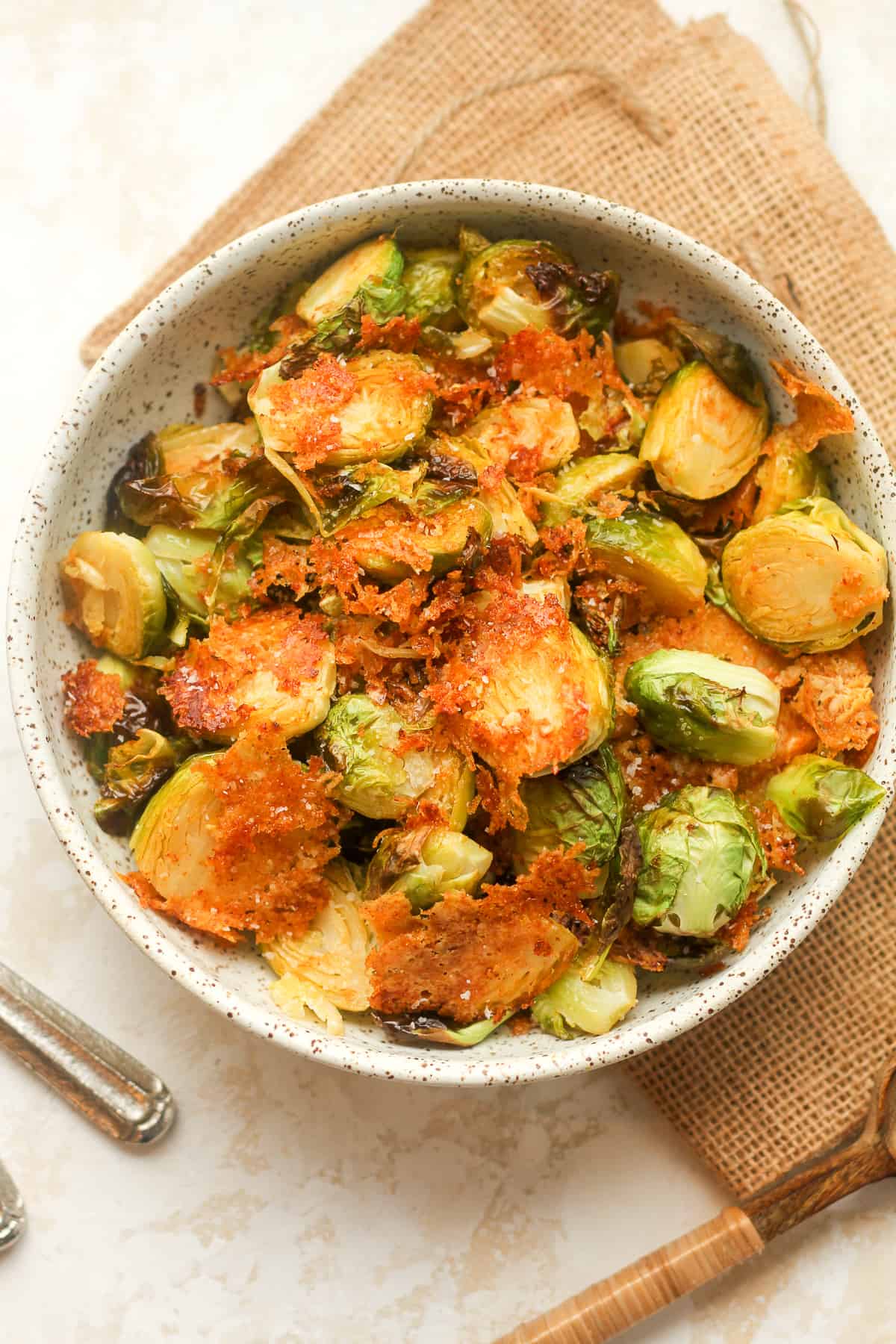A bowl of roasted Brussels sprouts with parmesan.