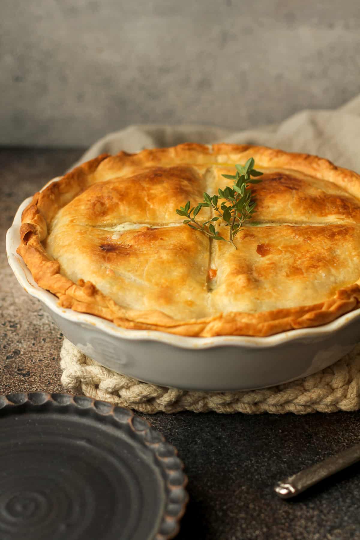 Side view of a chicken pot pie with a double crust.
