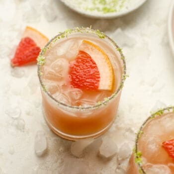 Closeup on a Paloma cocktail with a salty rim.