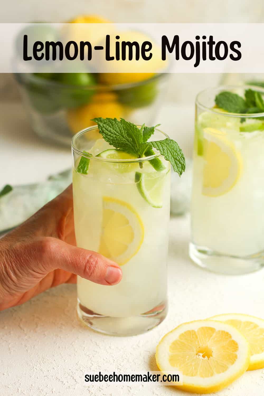 Two glasses of mojitos with lemon lime flavors.