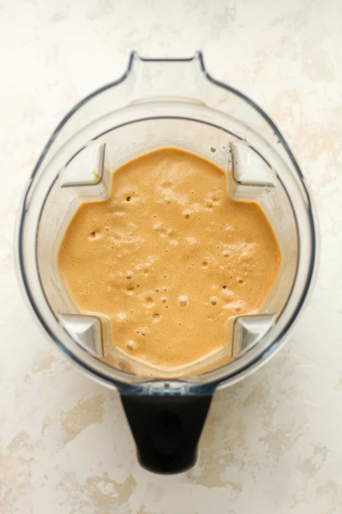Overhead view of a blender of coffee smoothie.