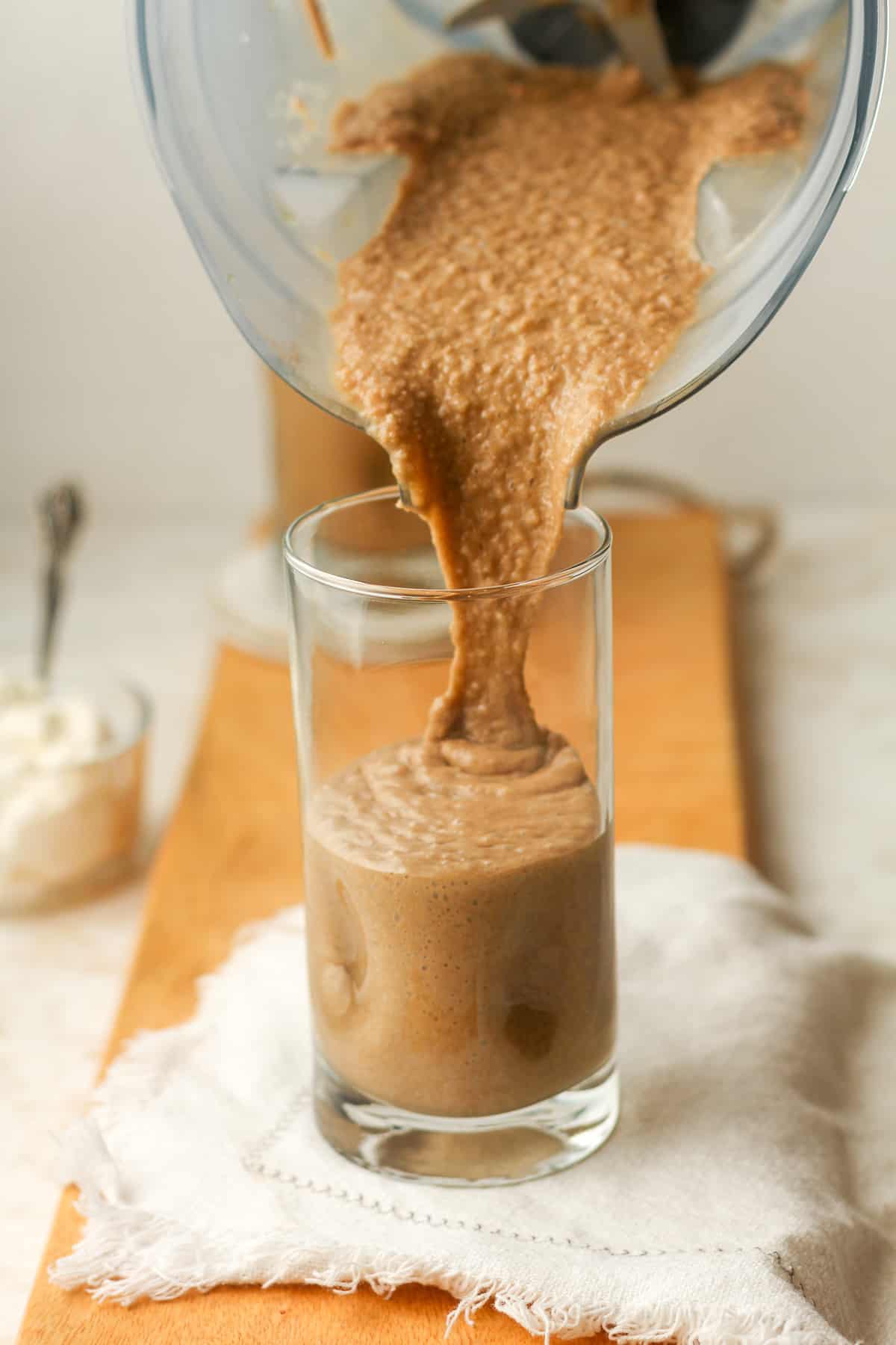 The coffee smoothie pouring into a glass.