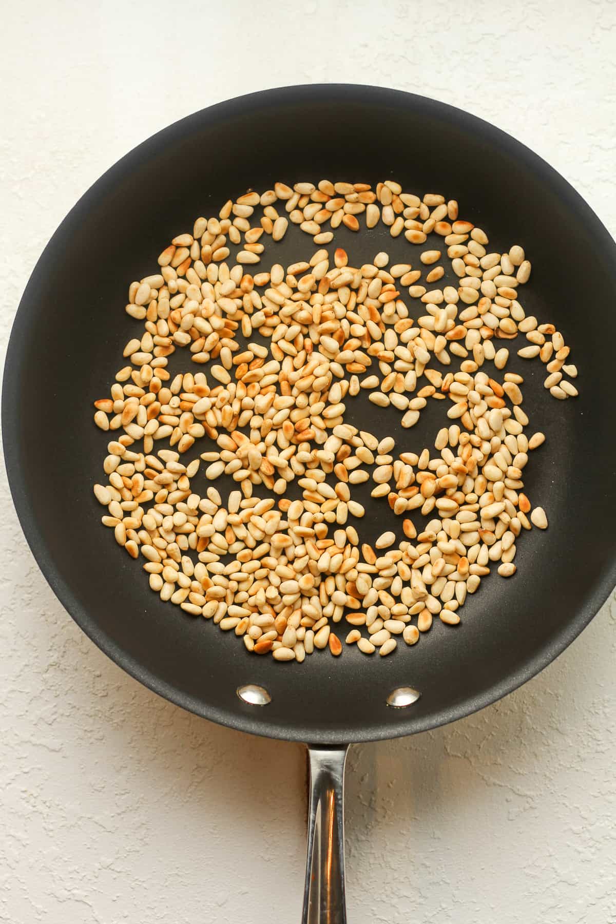 A pan of the toasted pine nuts.
