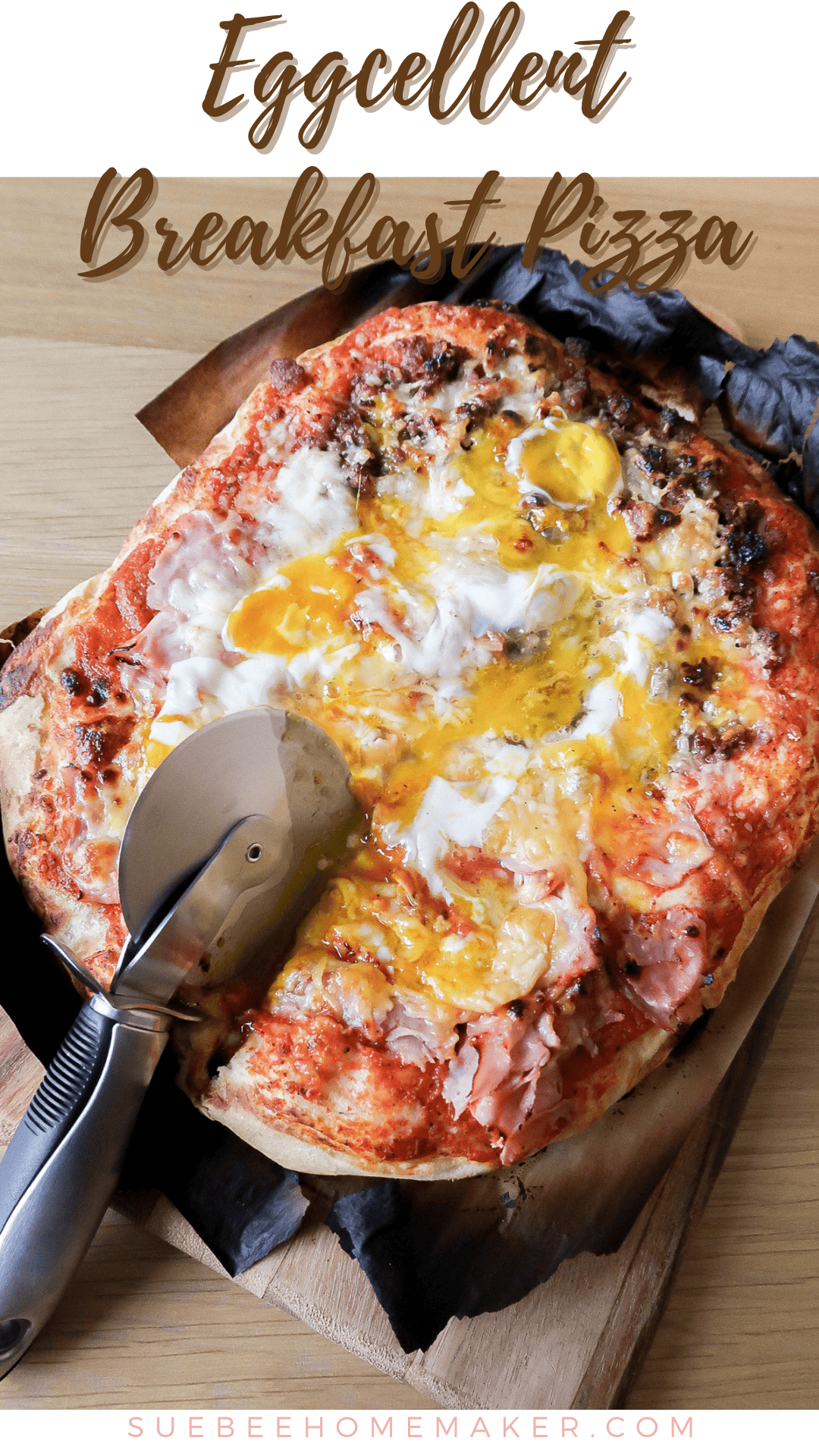 Eggcellent Breakfast Pizza- overhead photo of cooked pizza with a pizza cutter.
