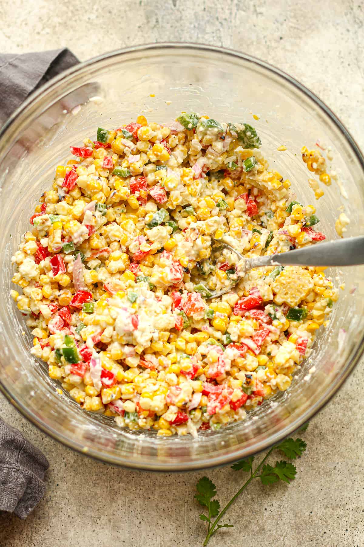 A bowl of the corn and veggies plus the dressing mixed in.