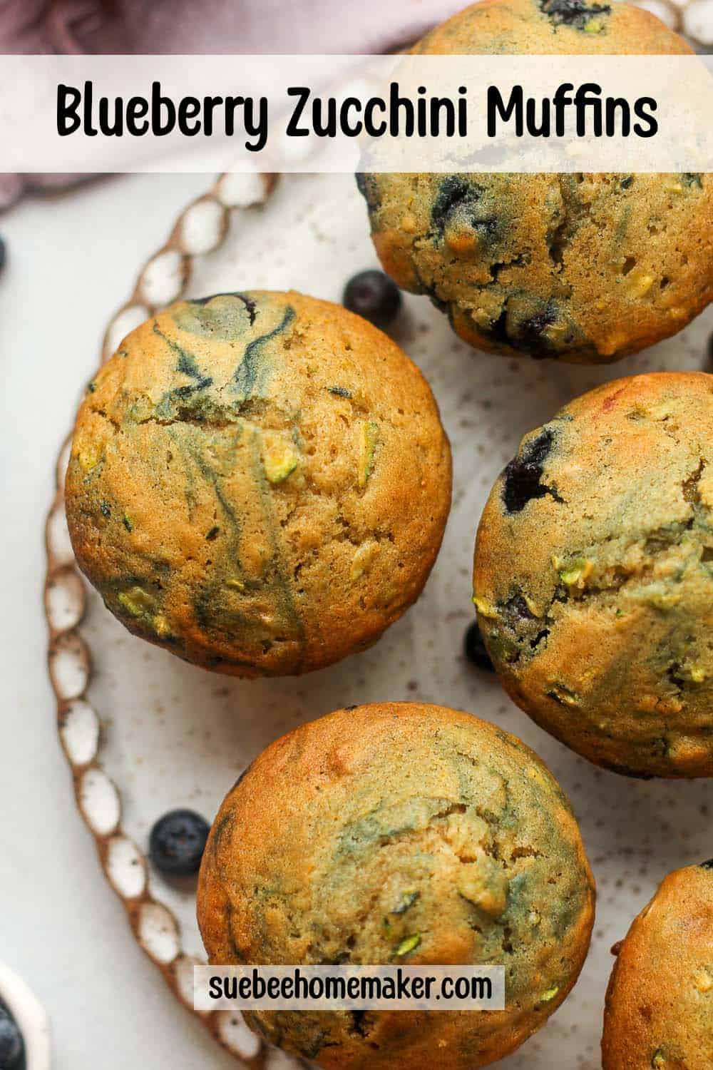 A plate of blueberry zucchini muffins.