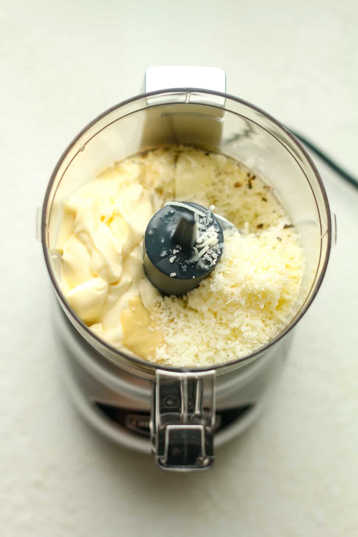 A food processor of the the ingredients for the dressing.