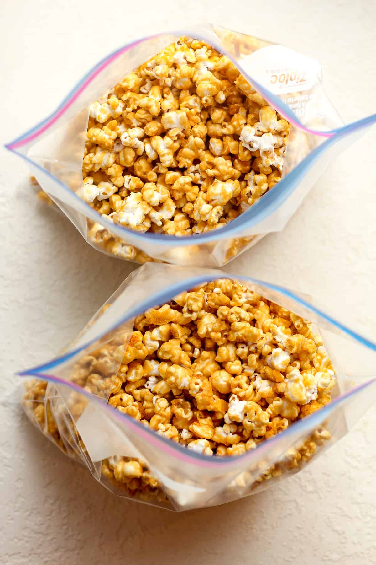 Two freezer bags of caramel popcorn.