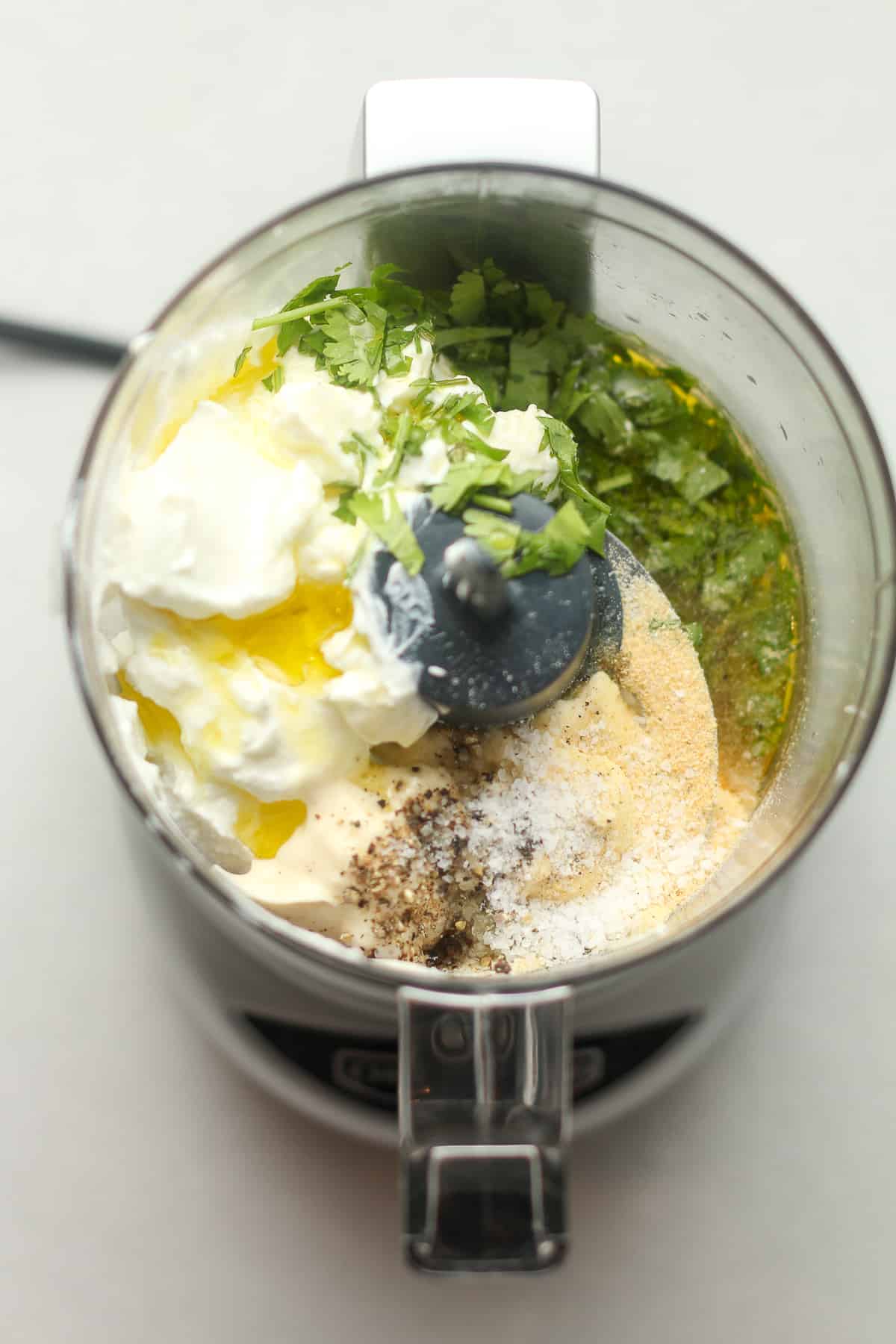 A small food processor of the ingredients for the cilantro lime dressing.