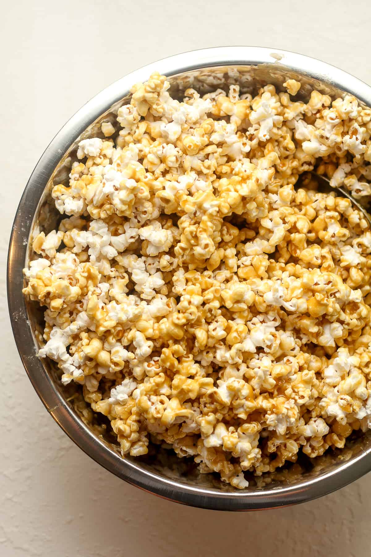 A bowl of the popcorn plus the caramel mixture.