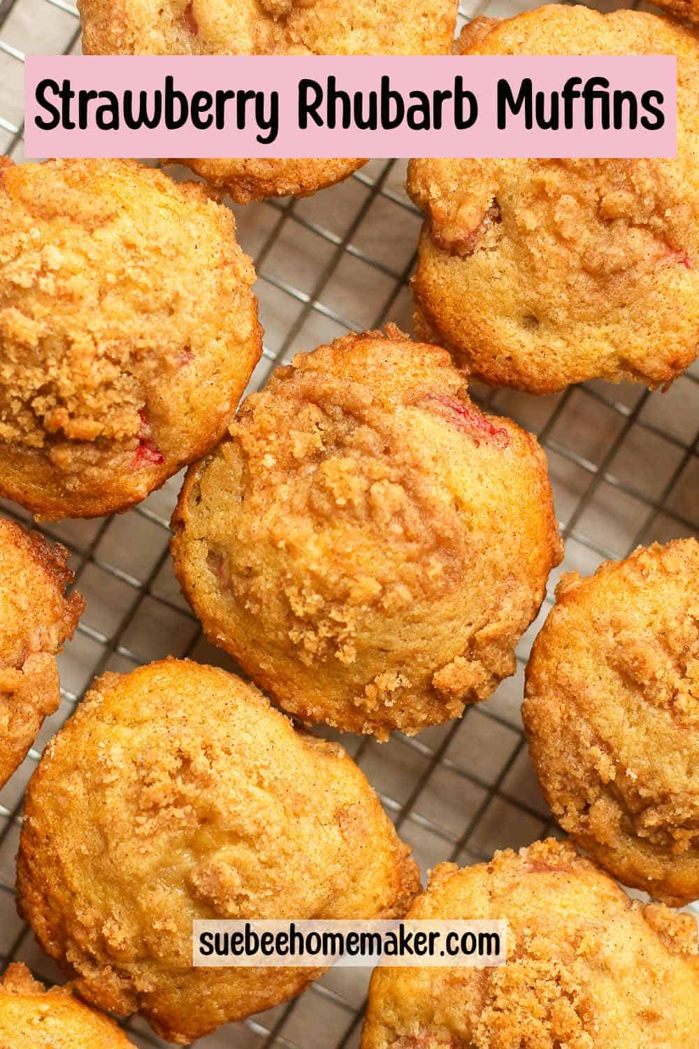 Closeup on some strawberry rhubarb muffins on a wire rack.
